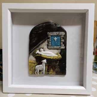 Framed Nativity with lamb.